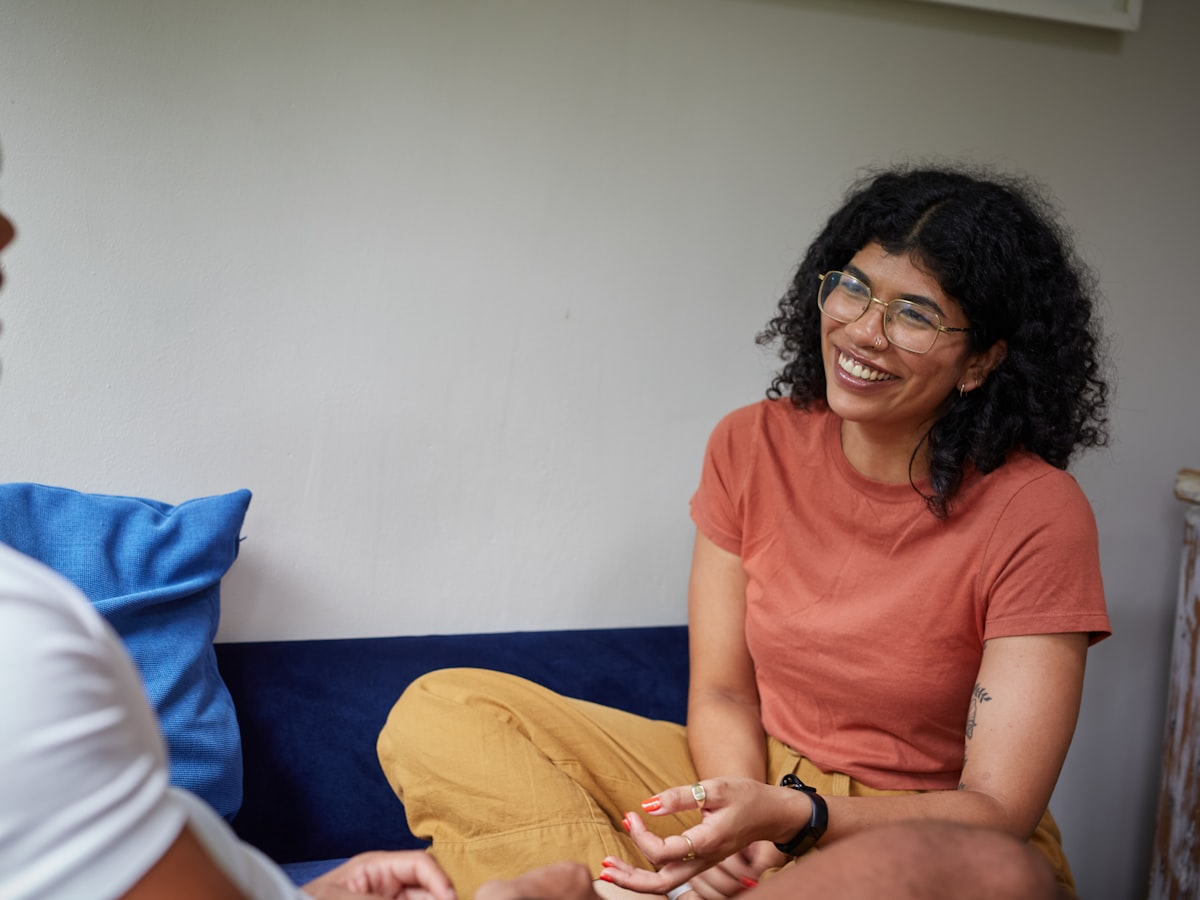 Two people talking together, relaxed and at ease